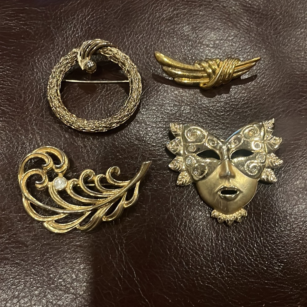 4 Vintage Brushed and Shiny Gold Tone Lapel Pins, 2 with Crystal Pieces.